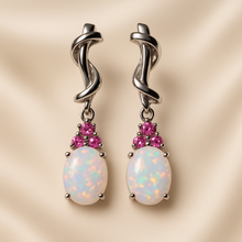 “Artisan-crafted gemstone earrings featuring healing white opal and ruby”
