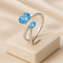 Jewelry shot of blue topaz adjustable ring by Curación Holística