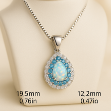 “Handcrafted white opal jewelry with aquamarine accents, promoting emotional healing and beauty.”