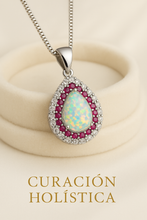 “Side profile of Curación Holística’s opal and ruby pendant, highlighting vibrant gemstone brilliance and sterling silver craftsmanship.”
