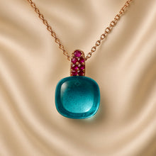 	Close-up of bronze-tone sterling silver chain and gemstone pendant