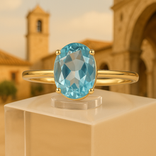 	Ring presented on a cream box with Spanish-inspired luxury setting