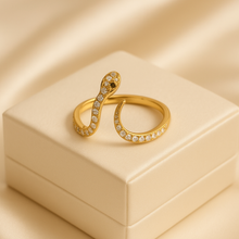 Handmade boho snake ring on creamy background