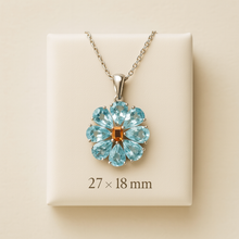 	Handmade aquamarine flower necklace with citrine center in sterling silver. With measurements 