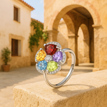Adjustable gemstone ring featuring amethyst, peridot, citrine, and garnet