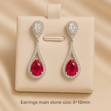 Close-up of 8x10mm ruby rose stones in luxury gift box
