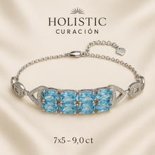“Handmade aquamarine and sterling silver bracelet with white quartz accents, displayed elegantly on a cream jewelry box – exclusive artisan jewelry by Curación Holística.”