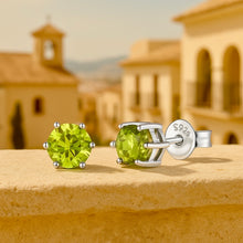 	Close-up view of prong-set peridot gemstone studs