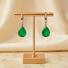 Verdant Tears of the Earth: Emerald & Sterling Echoes