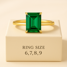 Emerald ring sizes 6 7 8 9 displayed on soft box
