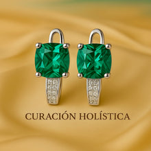 Close-up luxury photo of nano-emerald pavé earrings on neutral background