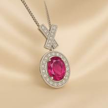 Close-up of ruby quartz necklace with snake-style silver chain