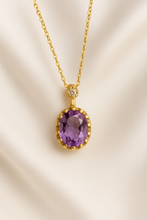 Elegant gold chain with healing amethyst crystal pendant