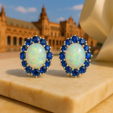 “Elegant opal and sapphire halo earrings – handmade sterling silver statement jewelry.”