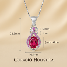 “Side angle view showcasing the detailed craftsmanship of ruby and pink stones pendant.”