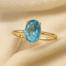 	Curación Holística branded packaging with aquamarine ring inside