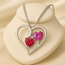 Boho chic heart-shaped ruby and topaz necklace showcasing vibrant colors and craftsmanship.”