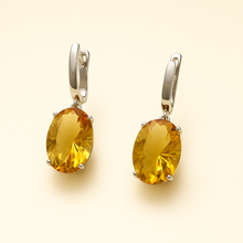 Artisan-crafted yellow gemstone earrings in solid silver