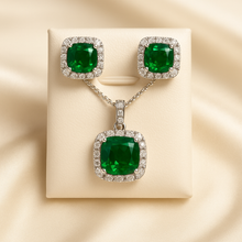 Coordinated silver jewelry set with vibrant green crystals