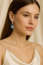 Model wearing earrings styled in a boho-chic outfit