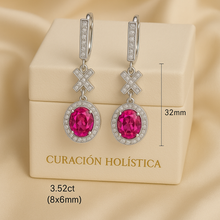 	Boho luxe ruby earrings in sterling silver on jewelry box with gold logo