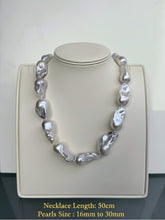 Pearl necklace on a mannequin with product details on a white background