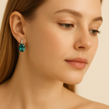Elegant statement nano-emerald earrings with sterling silver prong setting