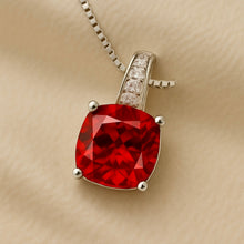 “Gift-ready packaging of Curación Holística ruby and quartz necklace.”