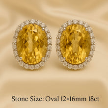 Close-up of radiant 18ct citrine earrings with white stones