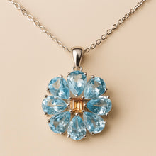 	Floral-shaped natural aquamarine pendant with handmade craftsmanship.