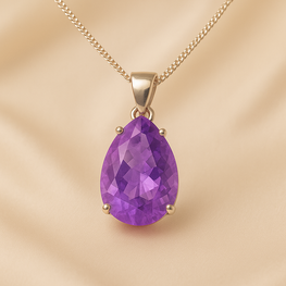 Close-up of purple amethyst stones in matching pendant and earrings