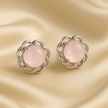 	“Elegant rose quartz stud earrings in sterling silver floral setting – Curación Holística exclusives.”