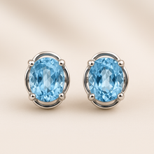 Handcrafted sterling silver earrings with natural blue aquamarine stones