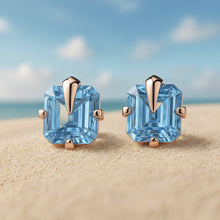 •	Handmade boho aquamarine earrings set in bronze and sterling silver on sandy background