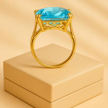 	Artisan aquamarine ring with rich golden prongs and detail.