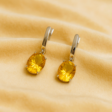 	Radiant citrine gemstone earrings with secure clasp setting