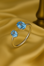 “Boho style Aquamarine Statement Ring in Sterling Silver, handcrafted and featuring vibrant light blue aquamarine stones.”