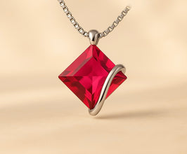 	Ruby rose small necklace with sterling silver chain on cream satin