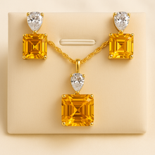 Elegant gold-toned necklace and earrings with yellow citrine stones