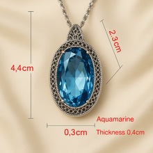 Blue gemstone necklace with intricate silver beaded detailing