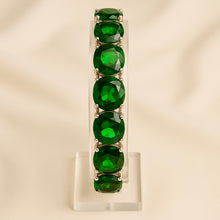 Side view of sterling silver emerald bracelet highlighting gemstone clarity.