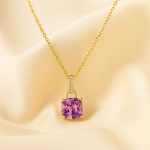 Handmade statement jewelry in sterling silver with purple gemstone