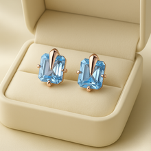 	Artisan-crafted boho earrings featuring aquamarine healing stones and Spanish craftsmanship