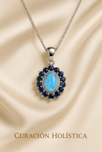 	“Luminous opal surrounded by natural sapphires in a delicate sterling silver setting, symbolizing spiritual protection.”