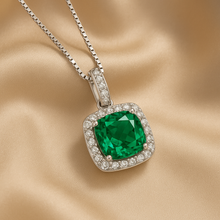 Cushion-cut green pendant with halo of white stones in silver