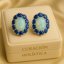 “Natural opal earrings surrounded by vivid blue sapphire gemstones – artisan-crafted jewelry.”