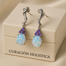 “Boho-style white opal and purple amethyst dangle earrings on luxury cream background.”