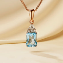 	Rose gold aquamarine pendant with white quartz on soft background