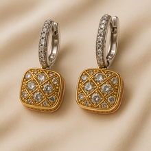 Boho luxe white quartz dangle earrings on warm architectural background