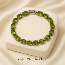.	Handmade peridot gemstone tennis bracelet on cream box